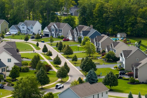 View from above of residential houses in living area. American dream homes as example of real estate development in US suburbs.